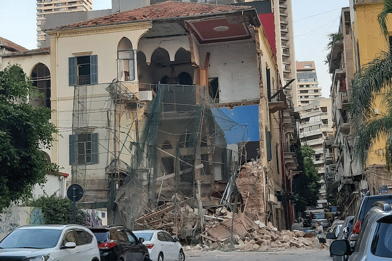 These images show various sites in Beirut on August 5, the day after the blast, and how they look now, one year on. This building has only been partially repaired.