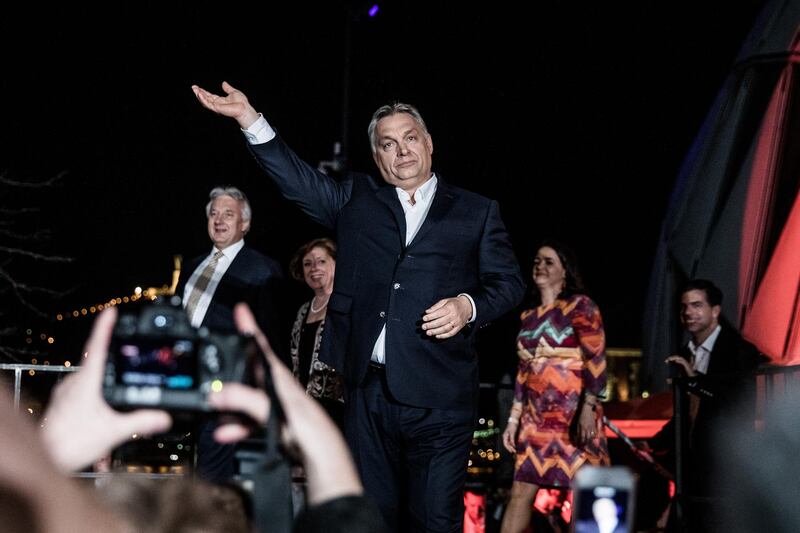 Viktor Orban, Hungary's prime minister, waves to supporters as he arrives at the Fidesz party headquarters following results for the parliamentary elections in Budapest, Hungary, on Monday, April 9, 2018. Orban scored a thumping victory to clinch another term after vowing to shield his country's identity as predominantly white and Christian and rallying populist forces that are challenging the values of the European Union. Photographer: Akos Stiller/Bloomberg