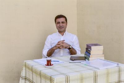 In this handout photo provided by the pro-Kurdish Peoples's Democratic Party (HDP), former party leader Selahattin Demirtas and current Turkish presidential candidate, sits in prison in Edirne on May 4, 2018. 
The HDP announced the nomination of Demirtas for the upcoming presidential elections in Turkey, scheduled for June 24, 2018. Demirtas, who has been behind bars since November 2016, is in prison accused of links to outlawed Kurdish rebels and is facing a 142-year sentence on charges of leading a terror organization. It's unclear if Turkey's electoral board will approve Demirtas's candidacy. / AFP PHOTO / Kurdish Peoples's Democratic Party (HDP) / HANDOUT / RESTRICTED TO EDITORIAL USE - MANDATORY CREDIT "AFP PHOTO / HDP" - NO MARKETING NO ADVERTISING CAMPAIGNS - DISTRIBUTED AS A SERVICE TO CLIENTS

