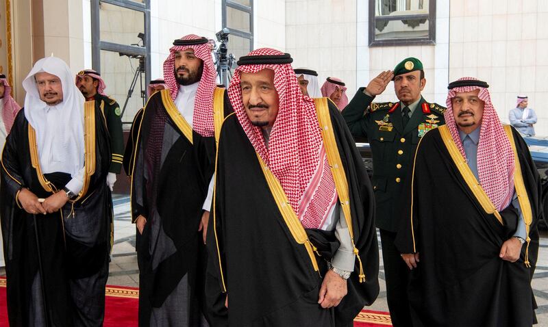 Saudi Arabia's King Salman bin Abdulaziz Al Saud (centre) and Crown Prince Mohammed bin Salman (second left) arrive at the Shura Council in Riyadh, Saudi Arabia. Saudi Royal Court / Reuters