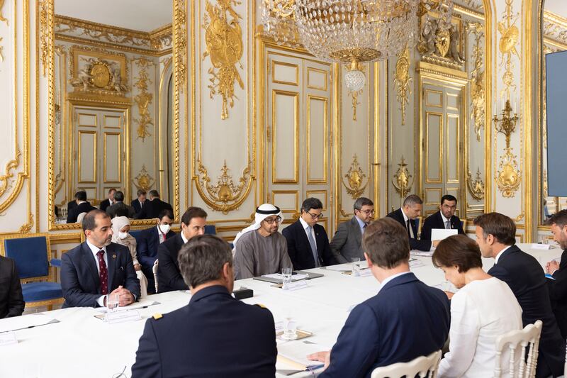Sheikh Mohamed with Mr Macron at the Elysee Palace. Also present are Sheikh Hamed bin Zayed, managing director of Abu Dhabi Investment Authority and Abu Dhabi Executive Council member; Sheikh Hazza bin Zayed, vice chairman of the Abu Dhabi Executive Council; Sheikh Mansour bin Zayed, UAE Deputy Prime Minister and Minister of the Presidential Court; Sheikh Abdullah bin Zayed, UAE Minister of Foreign Affairs and International Co-operation; Khaldoon Khalifa Al Mubarak, Abu Dhabi Executive Council member, chairman of the Executive Affairs Authority and managing director group chief executive of Mubadala Investment Company; and Dr Sultan Al Jaber, Minister of Industry and Advanced Technology, group chief executive of Adnoc and chairman of Masdar. Photo: Presidential Court