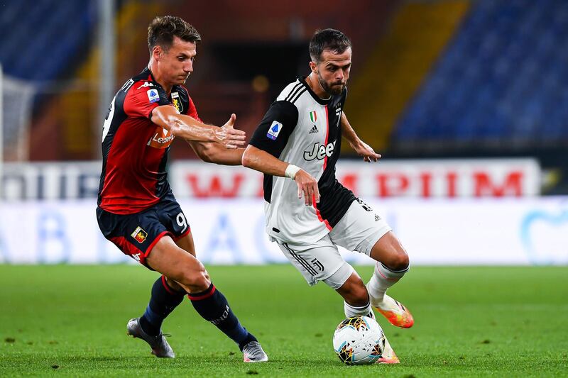Andrea Pinamonti of Genoa and Miralem Pjanic of Juventus vie for the ball. Getty Images