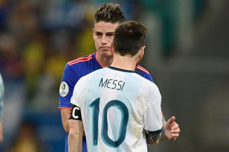 Colombia's James Rodriguez, left, and Argentina's Lionel Messi greet each other at the end of their Copa America match. AFP