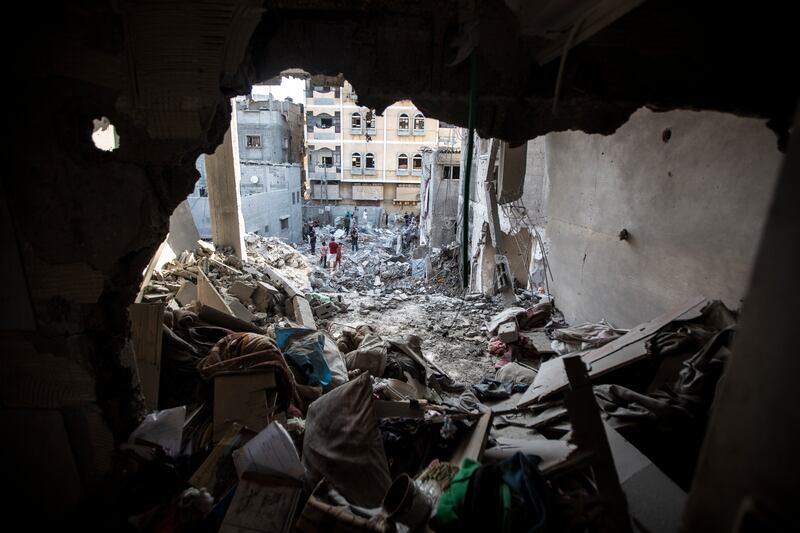 Palestinians search a destroyed building in which leading Islamic Jihad militant Khaled Mansour was killed by an Israeli air strike in Rafah. AP