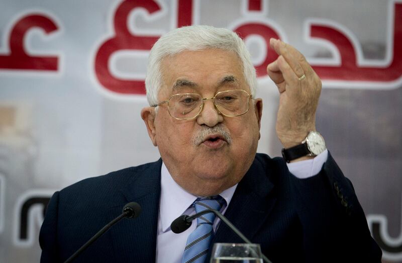 FILE - In this Oct. 28, 2018 file photo, Palestinian President Mahmoud Abbas speaks during a meeting of the Central Council of the Palestinian Liberation Organization in the West Bank city of Ramallah. Abbas said Wednesday, Feb. 20, 2019, that he will not accept a monthly tax transfer from Israel if it carries out its decision to deduct amounts the Palestinians pay to the families of prisoners and people killed in fighting with Israel. Abbas accused Israel of trying to put political pressure on him and violating longstanding economic agreements. (AP Photo/Majdi Mohammed, File)