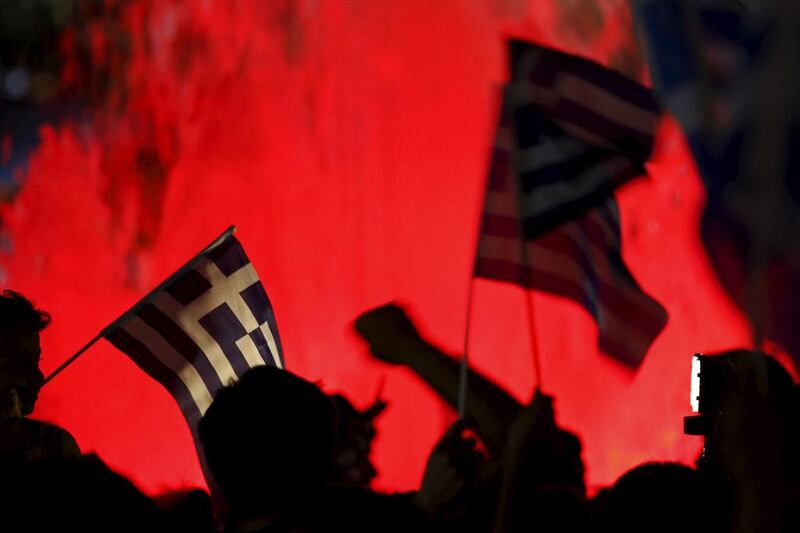 No supporters wave Greek national flags on the main Constitution square in Athens. Yannis Behrakis / Reuters