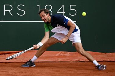 Russia's Daniil Medvedev returns a ball to France's Richard Gasquet during the ATP 250 Geneva Open tennis tournament in Geneva on May 17, 2022.  (Photo by Fabrice COFFRINI  /  AFP)