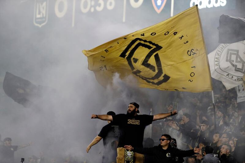 Fans cheer during the first half of an MLS soccer match between Los Angeles FC and Real Salt Lake in Los Angeles. AP Photo