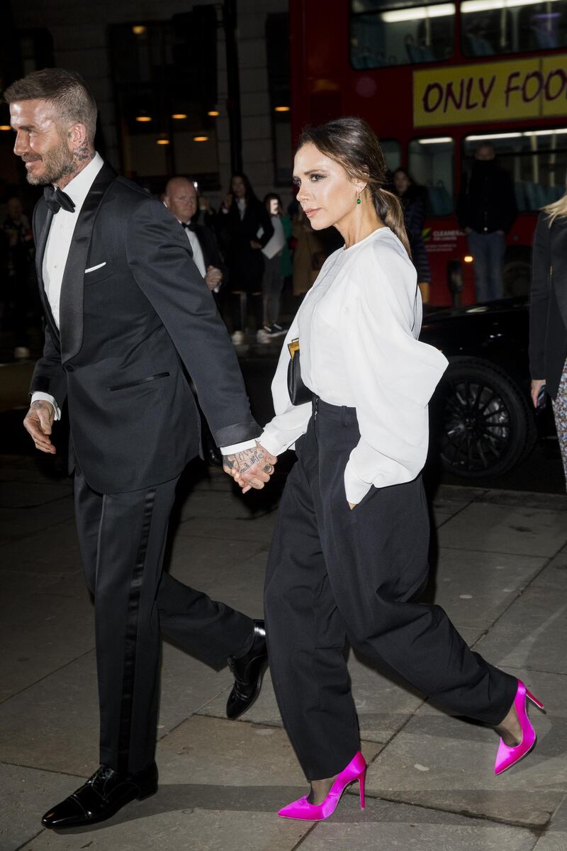 David and Victoria Beckham, wearing her own label, attend a gala at National Portrait Gallery on March 12, 2019. Getty Images