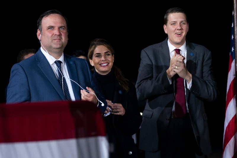 White House director of social media Dan Scavino, Counselor to the President Hope Hicks and and special assistant to the President and White House trip director William Russell listen as US President Donald Trump speaks during a campaign rally at Harrisburg International Airport. AP Photo
