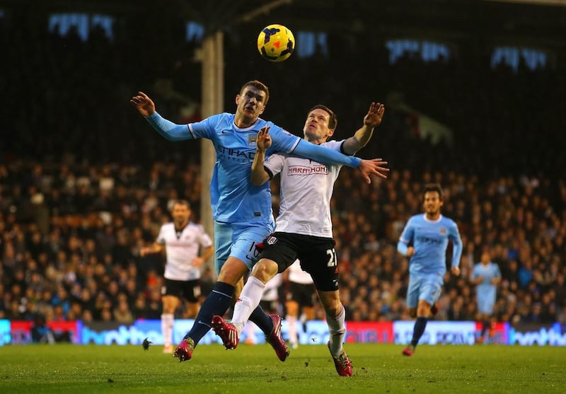 Edin Dzeko and his Manchester City teammates came out ahead in most of the battles against Sascha Riether and host Fulham. Clive Rose / Getty Images