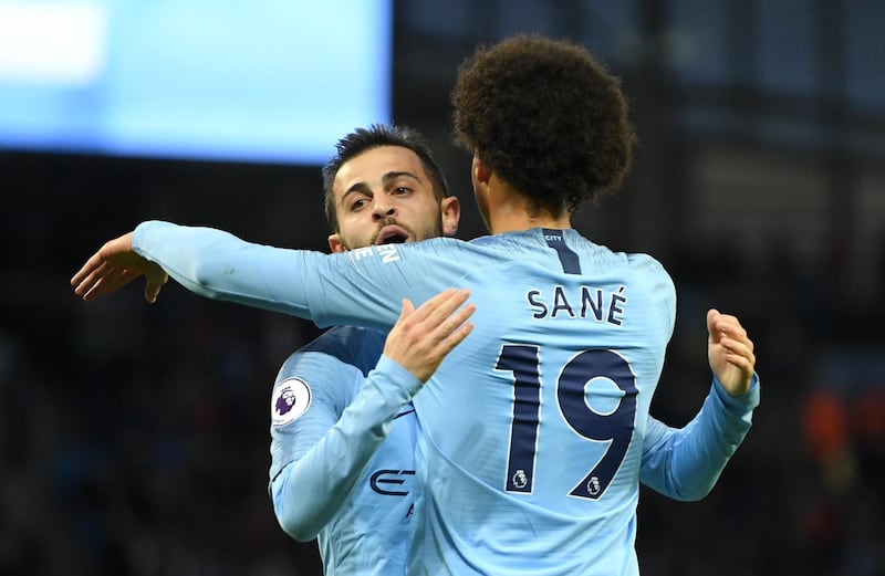 MANCHESTER, ENGLAND - MAY 09:  Bernardo Silva of Manchester City celebrates with Leroy Sane of Manchester City after scoring his sides second goal during the Premier League match between Manchester City and Brighton and Hove Albion at Etihad Stadium on May 9, 2018 in Manchester, England.  (Photo by Mike Hewitt/Getty Images)