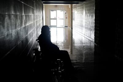 A man waits in a wheelchair in a hurricane shelter after Hurricane Harvey struck Rockport, Texas, U.S. August 26, 2017. REUTERS/Rick Wilking