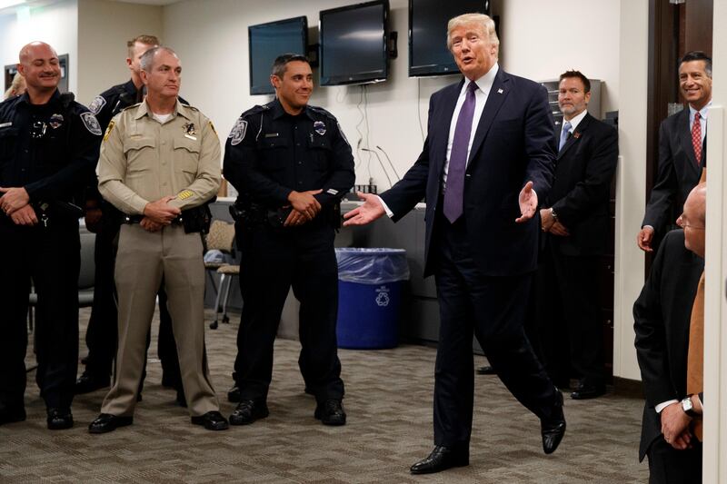 President Donald Trump arrives to meet with first responders at the Las Vegas Metropolitan Police Department in Las Vegas. Evan Vucci / AP Photo