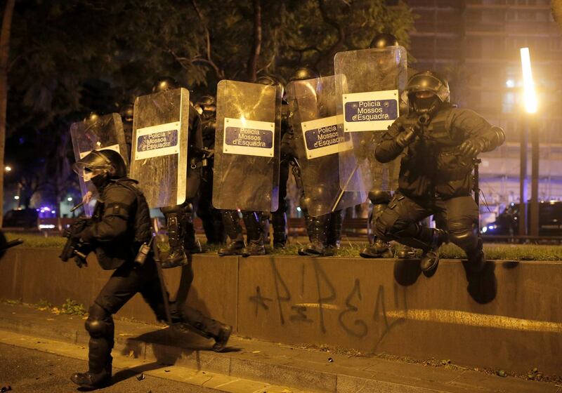 Police officers take position at the Catalan pro-independence protest outside the Camp Nou stadium. AP