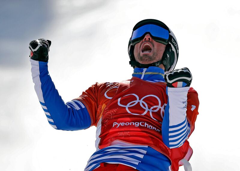 Pierre Vaultier, of France, celebrates after winning gold during the men's snowboard cross final at Phoenix Snow Park at the 2018 Winter Olympics. Gregory Bull / AP Photo