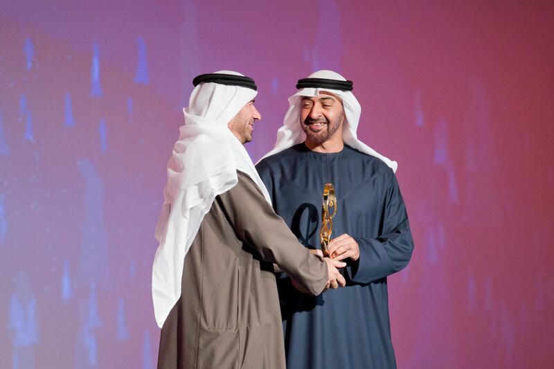 ABU DHABI, UNITED ARAB EMIRATES - January 24, 2012:  HH General Sheikh Mohamed bin Zayed Al Nahyan Crown Prince of Abu Dhabi Deputy Supreme Commander of the UAE Armed Forces, presents a 2011 Abu Dhabi Award to Saleh Al Sayed Al Hashimi, on behalf of Al Sayed Abdulla Al Sayed Al Hashimi, ( Ryan Carter / Crown Prince Court - Abu Dhabi )