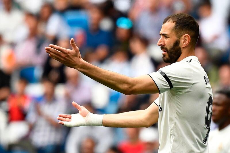 Real Madrid's French forward Karim Benzema gestures towards the referee. AFP