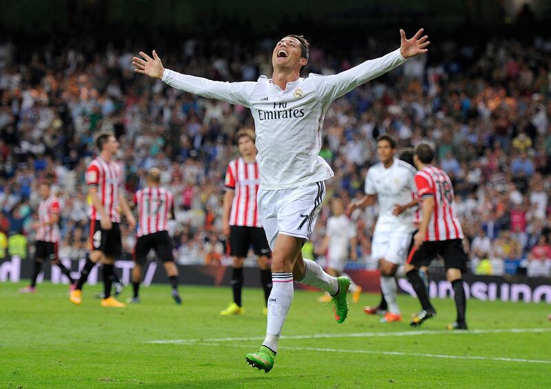 MADRID, SPAIN - OCTOBER 05:  Cristiano Ronaldo of Real Madrid celebrates after scoring his team's 5th and his third goal against Club Athletic during the La Liga match between Real Madrid CF and Athletic Club at Estadio Santiago Bernabeu on October 5, 2014 in Madrid, Spain.  (Photo by Denis Doyle/Getty Images)