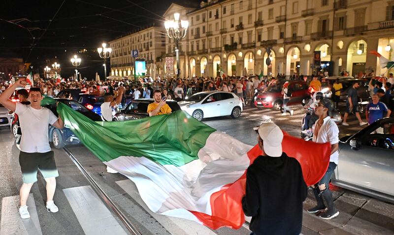 Italy fans celebrate  in Turin.