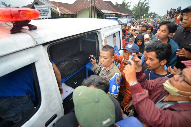 The body of a victim of the eruption of Mount Merapi lies in an ambulance in Nagari Batu Palano, Agam. Reuters