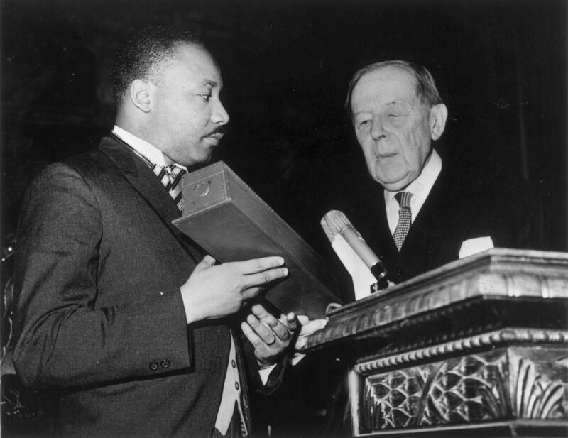 10th December 1964:  American civil rights leader Martin Luther King (1929  - 1968) (left) receives the Nobel Prize for Peace from Gunnar Jahn, president of the Nobel Prize Committee, in Oslo.  (Photo by Keystone/Getty Images)