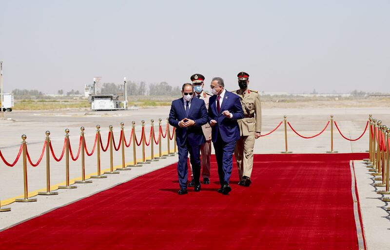 Iraqi Prime Minister Mustafa Al Kadhimi welcomes Egyptian President Abdel Fattah el Sisi at Baghdad International Airport. Reuters