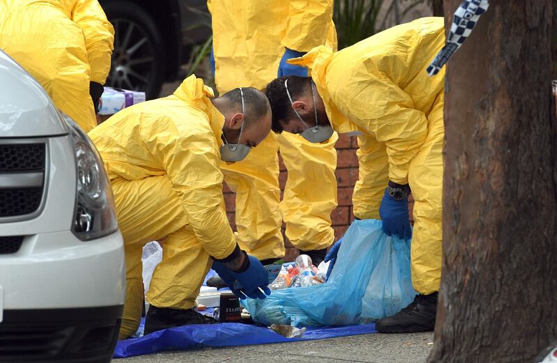 Police search for evidence at a block of flats in the Sydney suburb of Lakemba. William West.