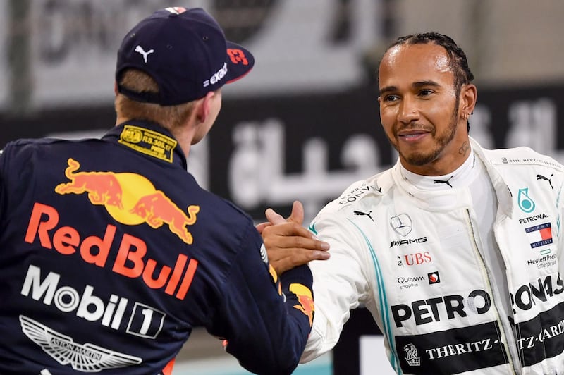 Red Bull's Max Verstappen, left, congratulates Mercedes' Lewis Hamilton. AFP