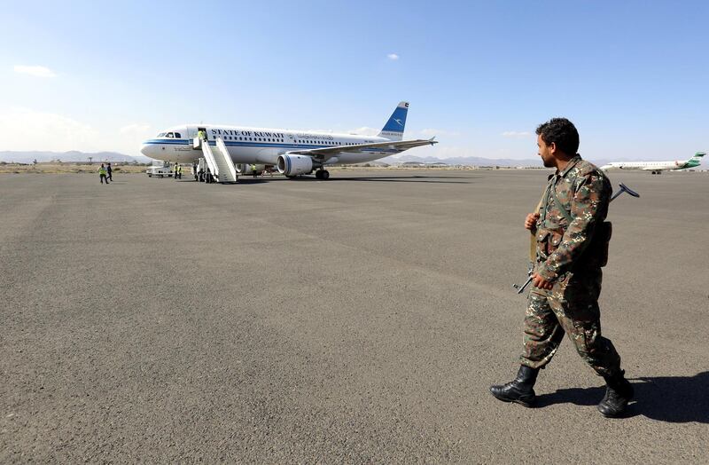 A soldier keeps watch as a Kuwait-chartered plane carrying members of the Houthi delegation lands at Sana'a International Airport in Yemen after attending UN-sponsored peace talks in Sweden. EPA