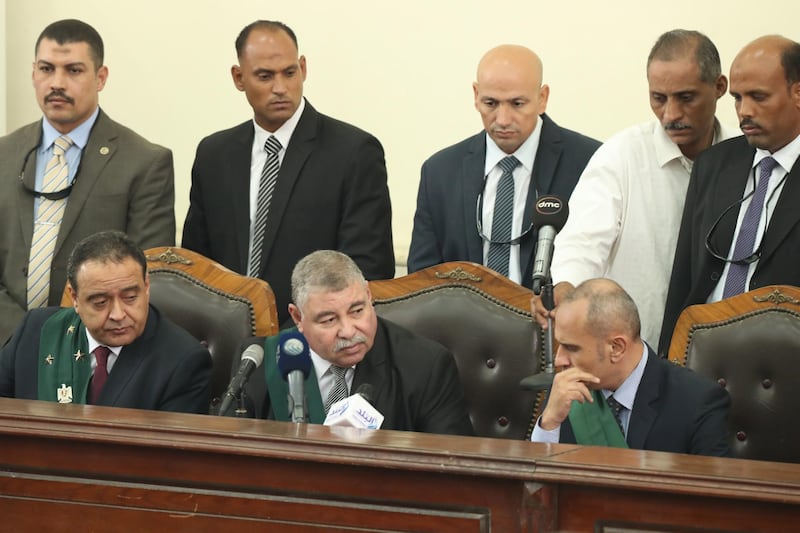 epa06915511 Judge Hassan Farid (C) speaks during a verdict session in the trial against top leaders of the Muslim Brotherhood group and others  in Cairo, Egypt, 28  July 2018, The defendants were involved in an alleged 2013 sit-in.  EPA/KHALED ELFIQI