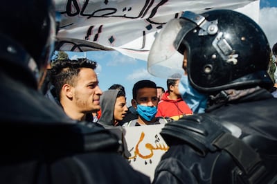 A tense standoff with riot police ensued when protesters tried to reach the Parliament building Tuesday. Erin Clare Brown for The National