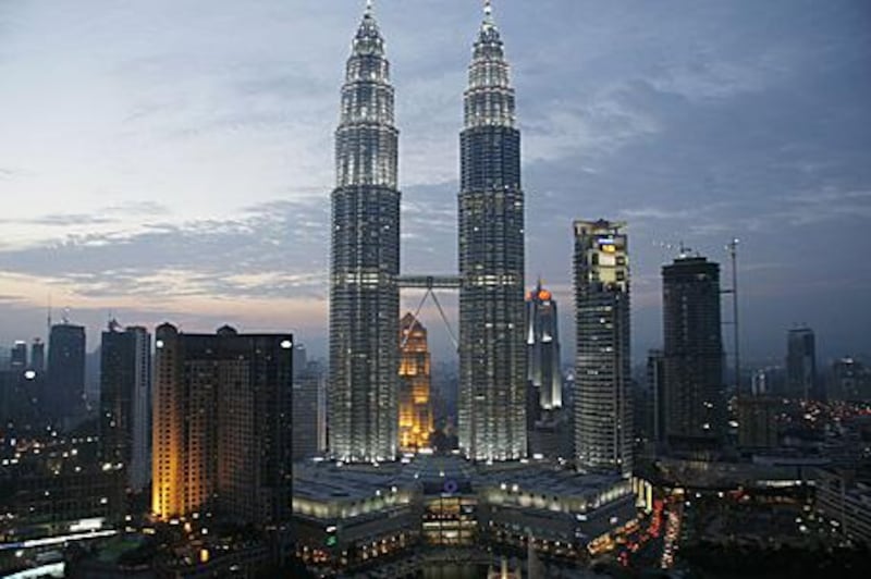 Kuala Lumpur's Petronas Towers, as viewed from the newly refurbished, 33rd-floor SkyBar, anchor the city's skyline and briefly enjoyed status as the world's tallest building before being surpassed by Taipei 101.
