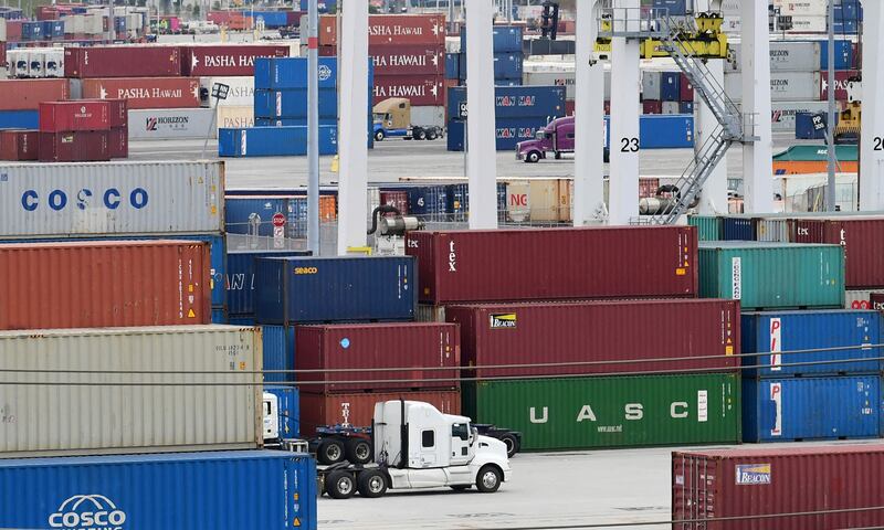 Container lorries make their way past stacked containers at the Port of Los Angeles in San Pedro, California. The US recorded export growth of 6.8 per cent in the second quarter. AFP