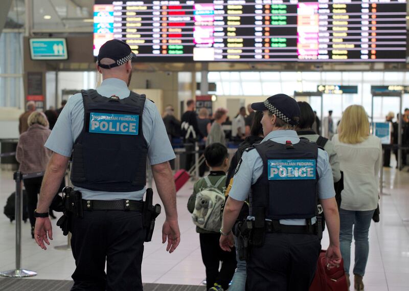 Australia Federal Police officers patrol the security lines at Sydney's Domestic Airport in Australia, July 31, 2017, following weekend raids related to a plot against Australia's aviation sector.  REUTERS/Jason Reed