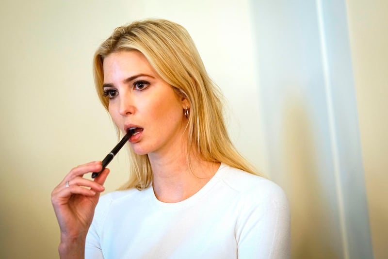 (FILES) In this file photo taken on June 20, 2018, Senior advisor to the president Ivanka Trump watches as US President Donald Trump speaks during a meeting with Republican members of Congress and Cabinet members in the Cabinet Room of the White House in Washington, DC. Ivanka Trump on July 24, 2018, announced the closure of her namesake clothing, footwear and accessories brand, which had become a target of opponents of her father President Donald Trump. After experiencing a sharp rise in sales in 2016, the brand suffered a backlash after her father took office, and has been dropped by several retail chains.
 / AFP / Mandel Ngan
