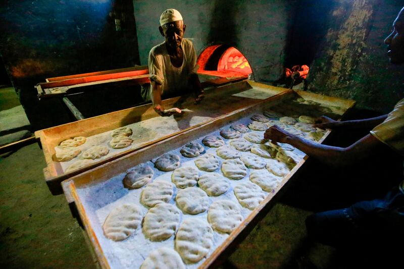 Sudanese bakers prepare bread at a bakery in the town of Atbara, an industrial town 350 kilometres northeast of Sudan’s capital Khartoum.  AFP