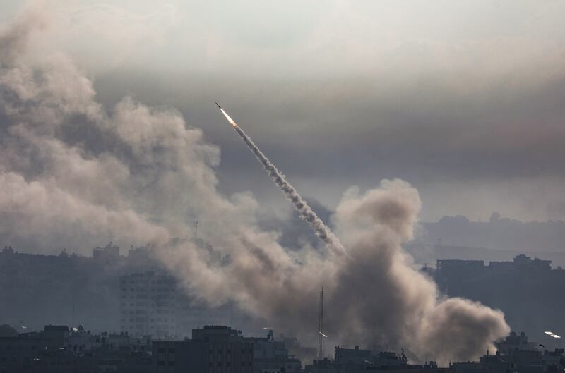 A rocket is launched from the Gaza strip towards Israel by militants of the Ezzedine Al Qassam Brigades, the military wing of Hamas. EPA