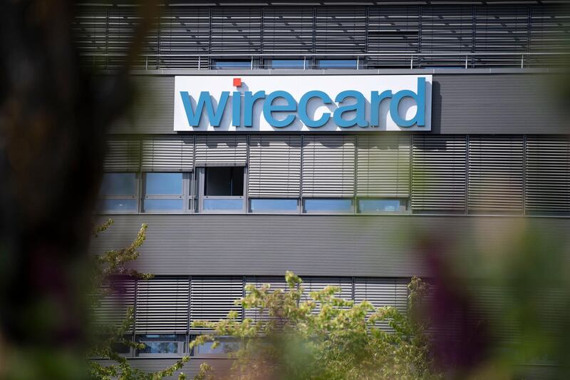 epa08496190 (FILE) - The logo of the financial services company Wirecard at the company headquarters building in Aschheim near Munich, Bavaria, Germany, 25 April 2019 (reissued 19 June 2020). According to reports, Wirecard shares lost about 65 percent as the German payment processor announced, its auditor can't find evidence for a quarter of the cash on its balance sheet.  EPA/LUKAS BARTH-TUTTAS *** Local Caption *** 55147121
