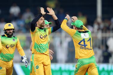 Sharjah, United Arab Emirates - December 02, 2018: Pakhtoons' Sharafuddin Ashraf takes the wicket of Warriors' Nicholas Pooran during the game between between Pakhtoons and Northern Warriors in the T10 final. Sunday the 2nd of December 2018 at Sharjah cricket stadium, Sharjah. Chris Whiteoak / The National