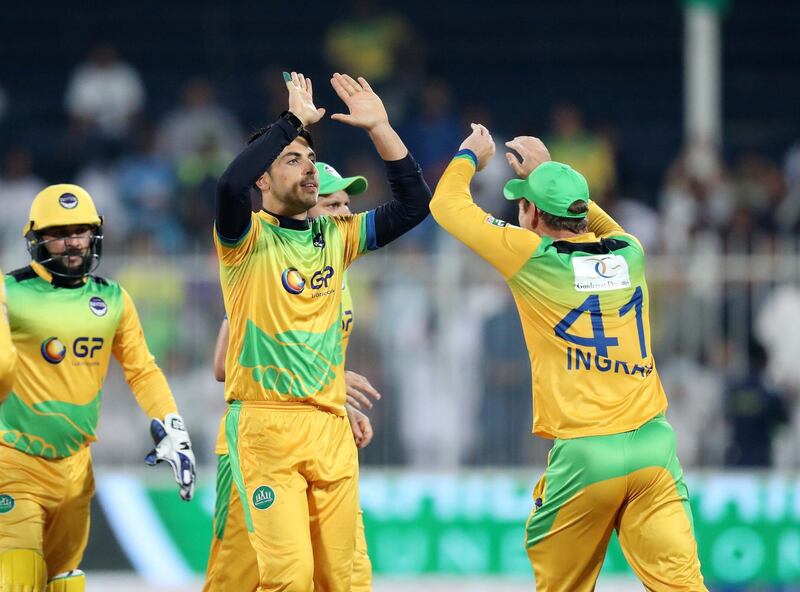 Sharjah, United Arab Emirates - December 02, 2018: Pakhtoons' Sharafuddin Ashraf takes the wicket of Warriors' Nicholas Pooran during the game between between Pakhtoons and Northern Warriors in the T10 final. Sunday the 2nd of December 2018 at Sharjah cricket stadium, Sharjah. Chris Whiteoak / The National