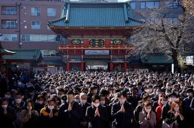 Business people offer prayers for prosperity for their companies and the economy on the first business day of the year at the Kanda Myojin Shrine in Tokyo in January. EPA