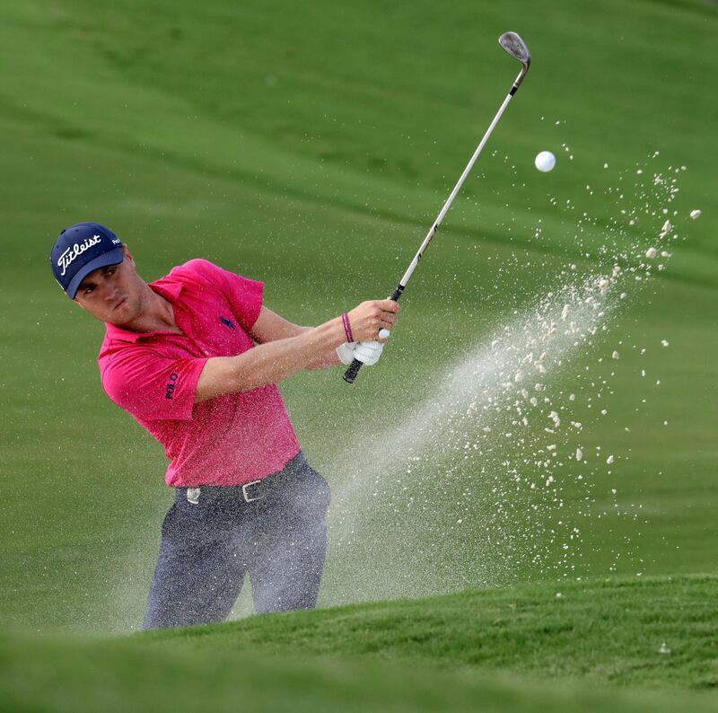 Justin Thomas hits from the bunker on the 18th hole during the final round of the PGA Championship golf tournament at the Quail Hollow Club Sunday, Aug. 13, 2017, in Charlotte, N.C. (AP Photo/John Bazemore)