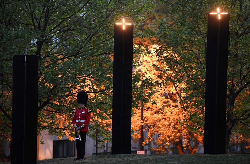 A member of the Band of the Grenadier Guards during the dawn service at Hyde Park Corner. AFP