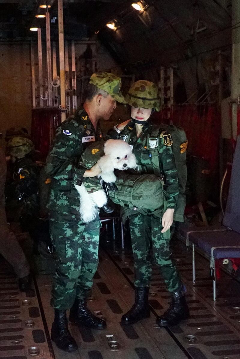 Thai King Maha Vajiralongkorn chats with Thai royal consort Sineenat on a military aircraft, in an image released by the royal palace of Thailand in August. EPA