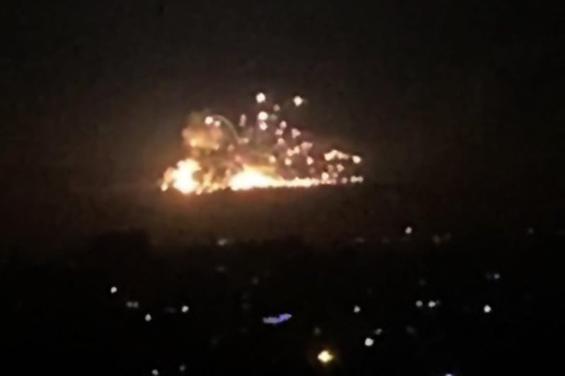 An image grab shows on November 20, 2019 smoke and fire billowing during a reported  Israeli air strike on the outskirts of Damascus. - The Israeli army confirmed that it carried out strikes against military sites in Damascus today, in response to rocket fire from Syria the previous day. "We just carried out wide-scale strikes of Iranian Quds Force & Syrian Armed Forces targets in Syria in response to the rockets fired at Israel by an Iranian force in Syria," the Israel Defense Forces tweeted. Syria's state media earlier said Syrian anti-aircraft defences intercepted a "heavy attack" by Israeli warplanes over the capital Damascus. (Photo by - / AFP)