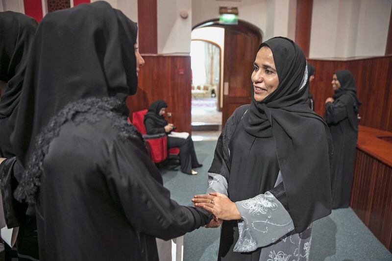 Dr Shaikha Al Ari, right, an FNC member from Umm Al Quwain, talks to a former student at a symposium focused on women’s empowerment at the General Women’s Union in Abu Dhabi. Silvia Razgova / The National 