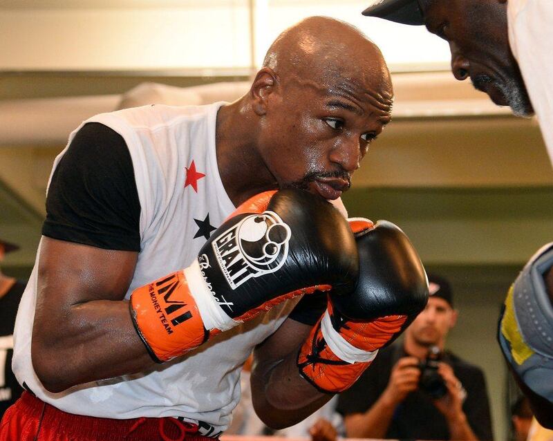 Floyd Mayweather spars with his trainer and uncle Roger Mayweather at the Mayweather Boxing Club on Tuesday. Ethan Miller / Getty Images / AFP / April 22, 2014