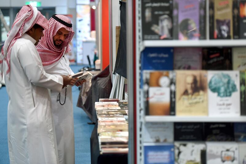 Saudi men browse the annual International Book Exhibition in the capital Riyadh on March 4, 2015. The exhibition features more than 900 publishers as it officially opened today and will continue until March 14. AFP PHOTO / FAYEZ NURELDINE / AFP PHOTO / FAYEZ NURELDINE