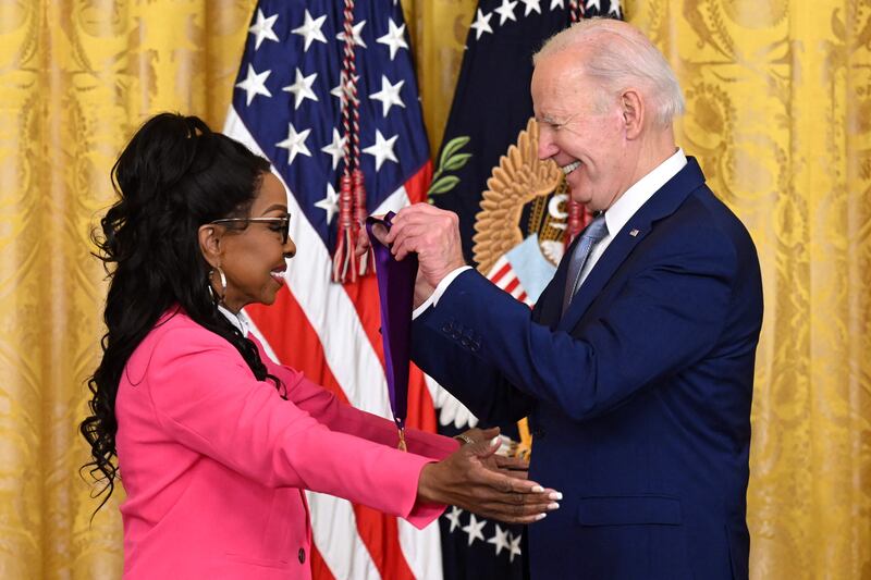 Mr Biden awards singer Gladys Knight with the 2021 National Medal of Arts. AFP